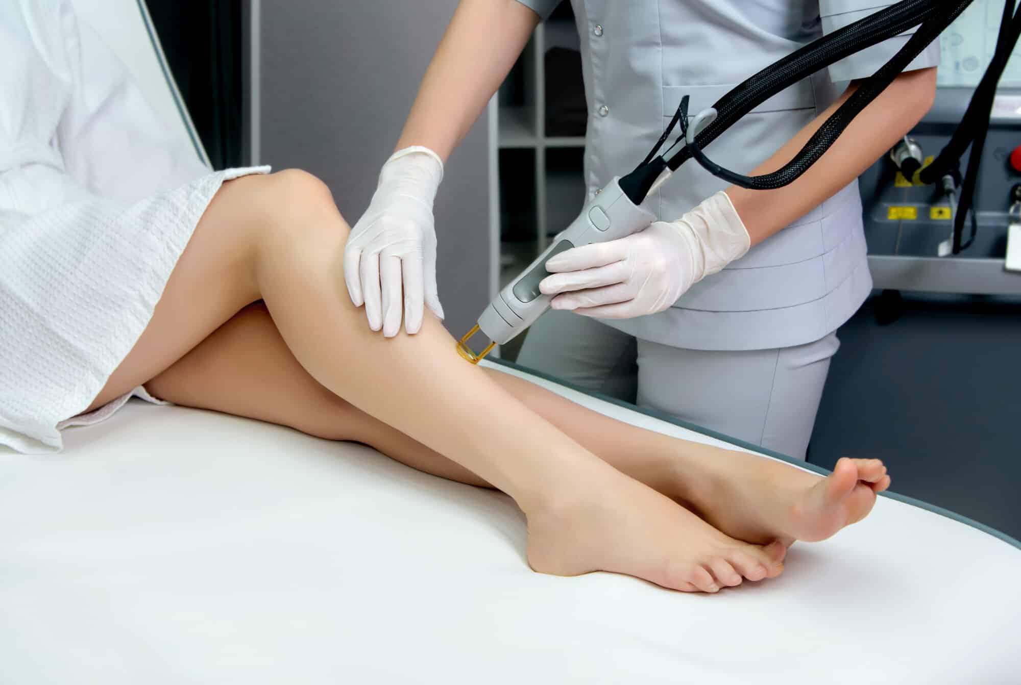 Hair removal cosmetology procedure from a therapist at cosmetic