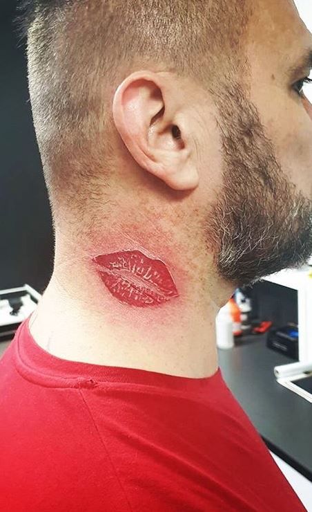 kiss tattoo on Neck