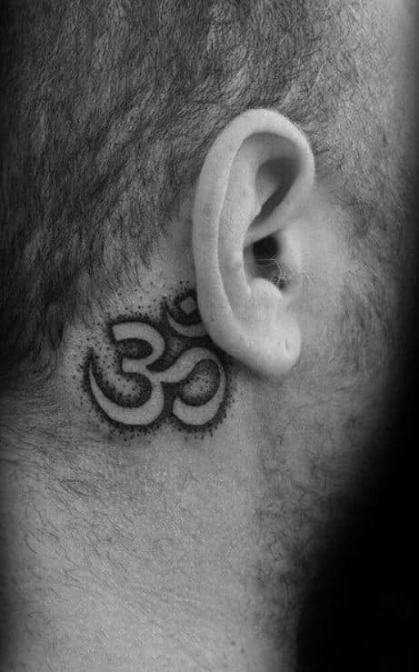 Hindu symbol tattoo behind the ear for men