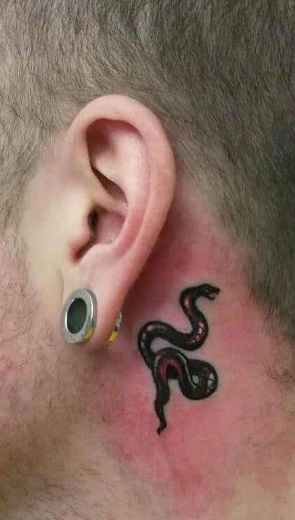 Behind ear tattoo