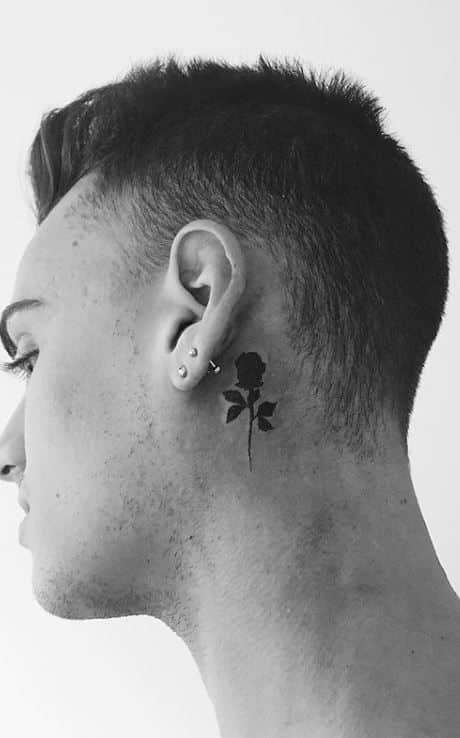 rose behind ear tattoo male