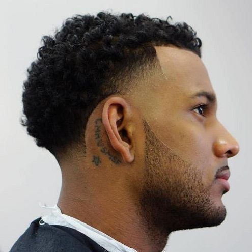 Behind the ear tattoo for black male