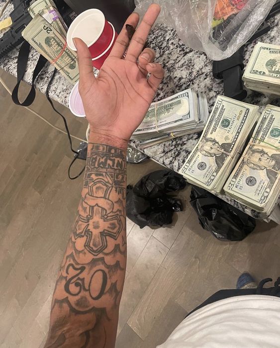 Money Gangster hood forearm tattoos