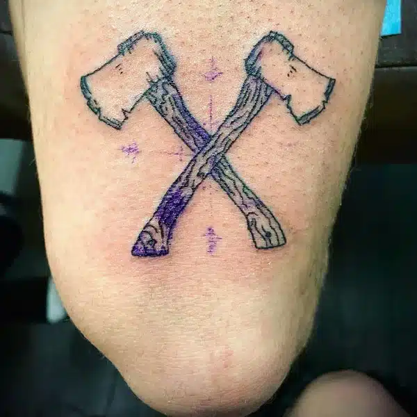 axe above knee tattoo 