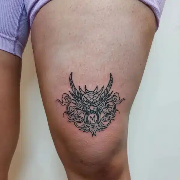 Above knee Tattoo Designs