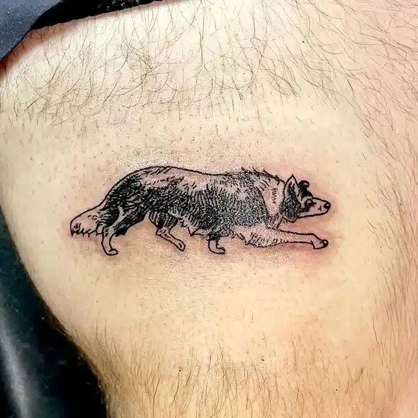 Wolf above knee tattoo