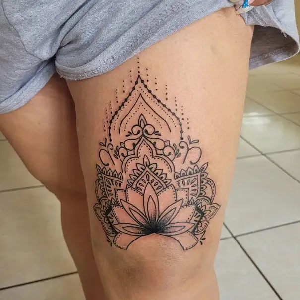 Crown above knee tattoo