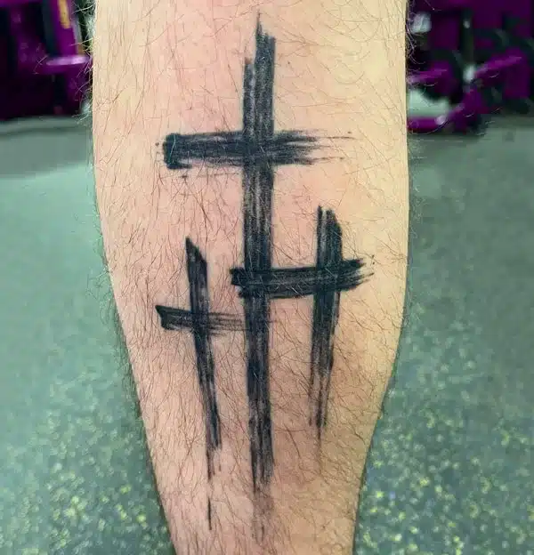 3 Cross Tattoo on hairy leg