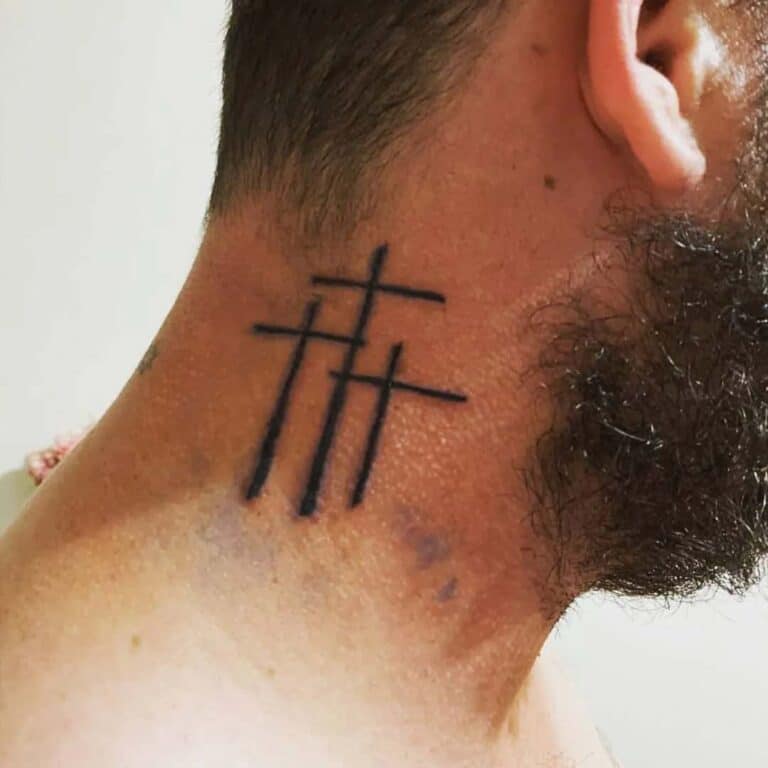3 Cross Tattoo on men behind ear 