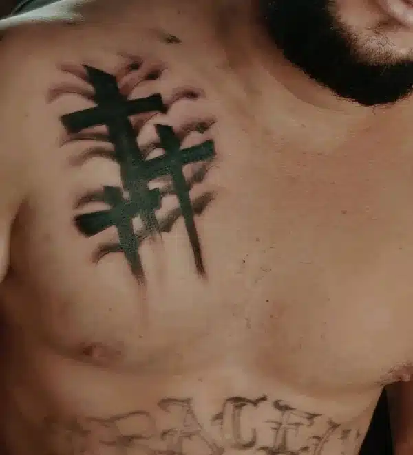 Men got 3 Cross Tattoo on one chest