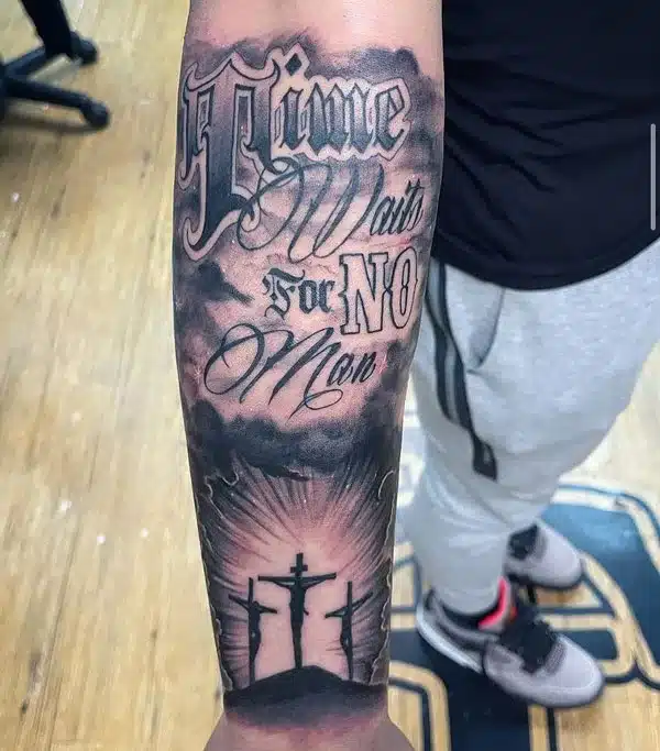 3 Cross Tattoo on forearm with words Time waits for no Man