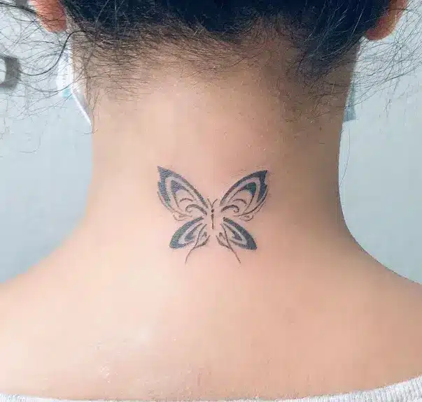 Small butterfly tatto on back neck
