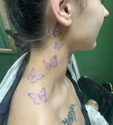 5 butterflies tattoo from neck to behind the ear for girl