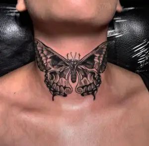 black butterfly tattoo on neck 