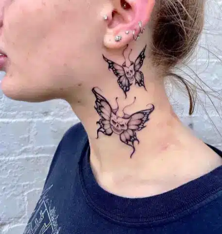 one big and one small butterfly tattoo on neck