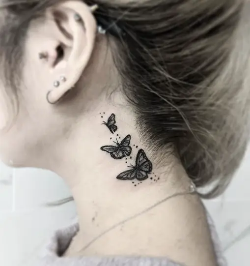 3 butterflies on neck for girl tattoo