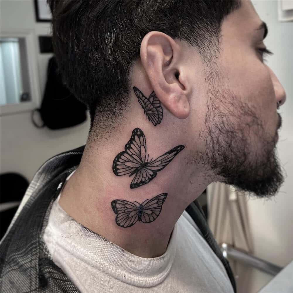Butterfly tattoo on neck and behind the ear