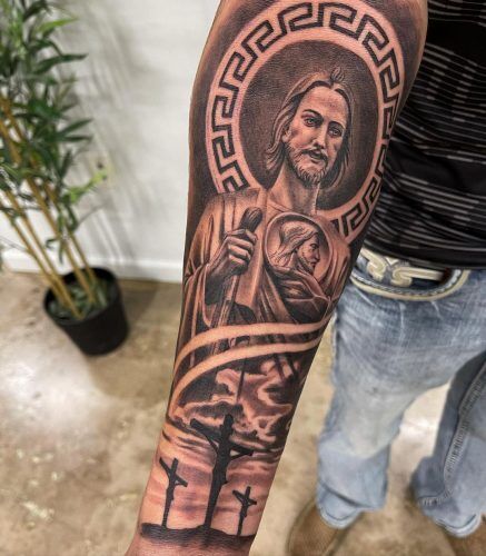 Men showing San Judas Tattoo on Forearm