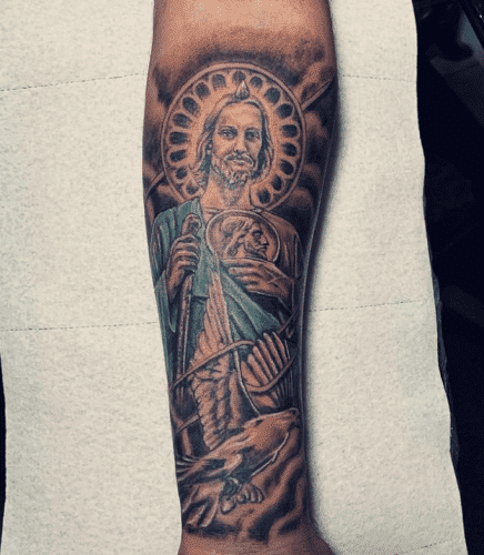 Symbol of faith San judas tattoo on forearm