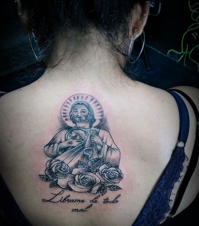 San Judas Tattoo on Girl Back