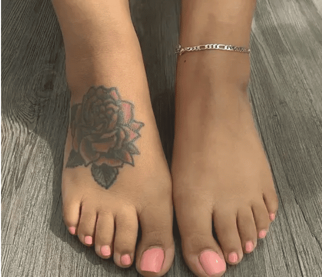 black inked Rose Tattoo on foot design
