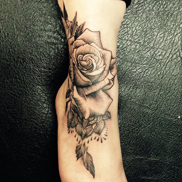 black inked Rose Tattoo on ankle and foot