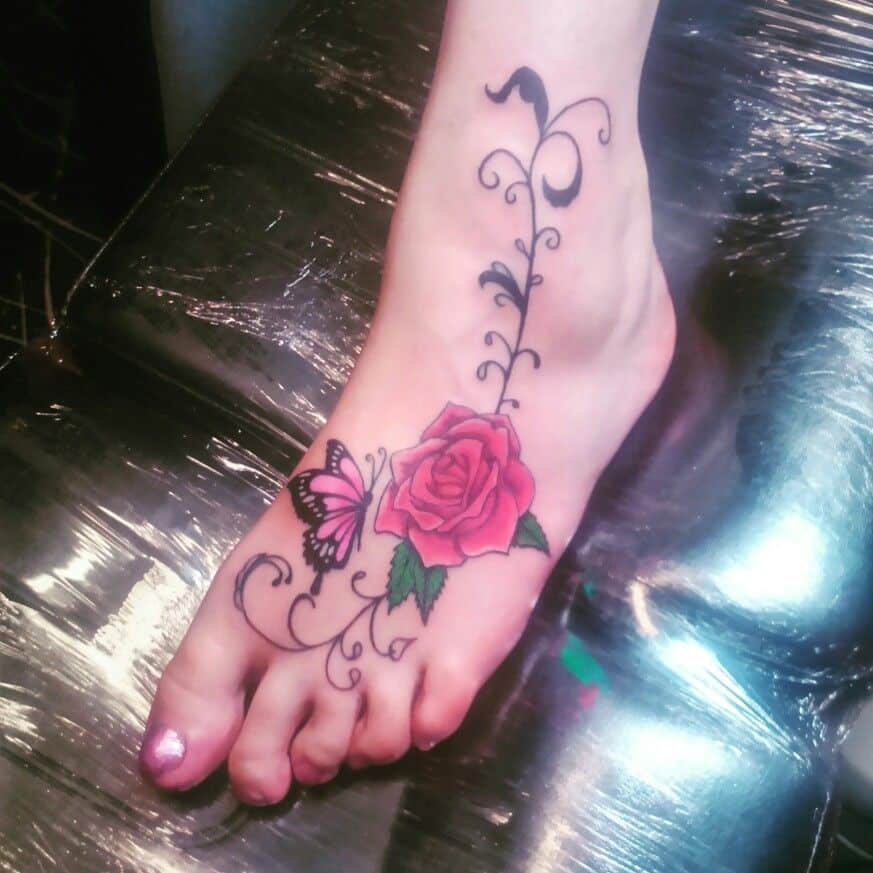 Colored inked Rose Tattoo on ankle and foot