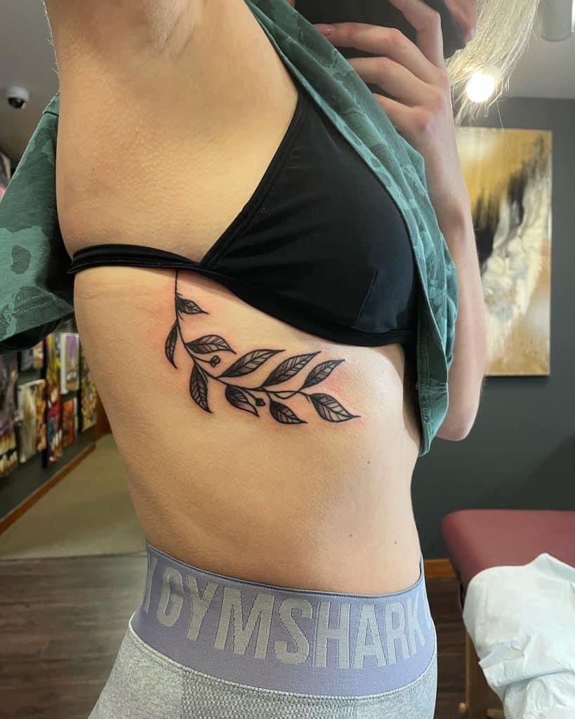 plant branch side belly tattoo for girls