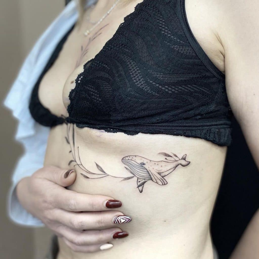Fish with plant branch for side belly tattoo for girls