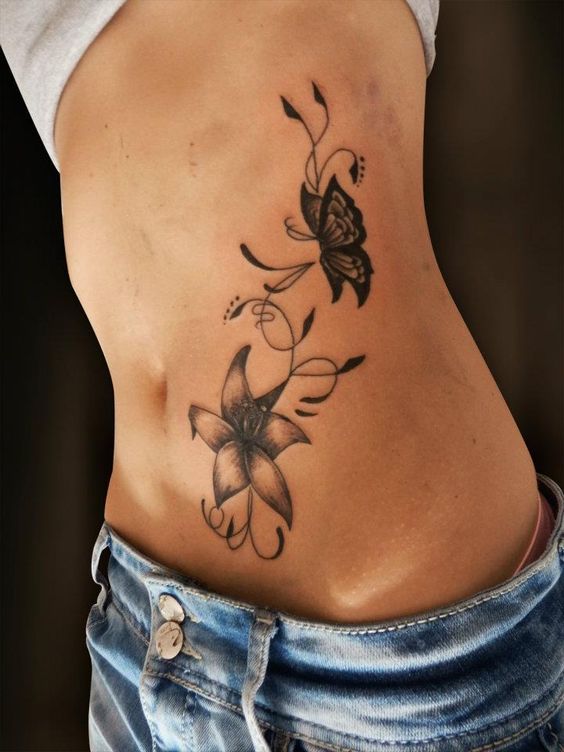 branch of flower and butterfly for side belly tattoo for girls