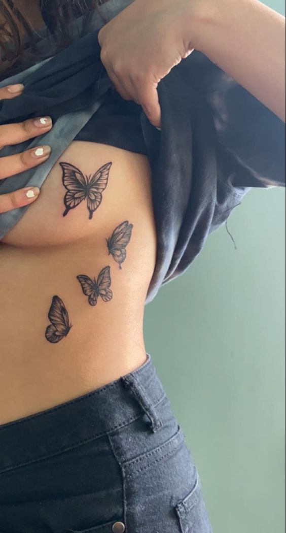 Butterflies on breast and side belly tattoo for girls