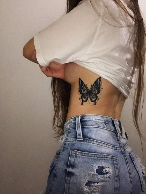 Big black butterfly's side belly tattoo for girls