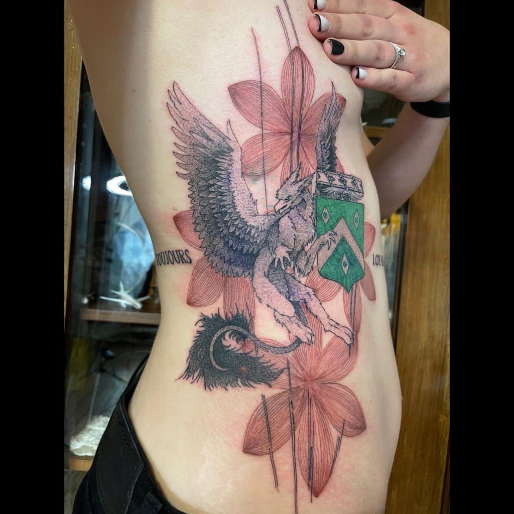 bird in flowers side belly tattoo for girls