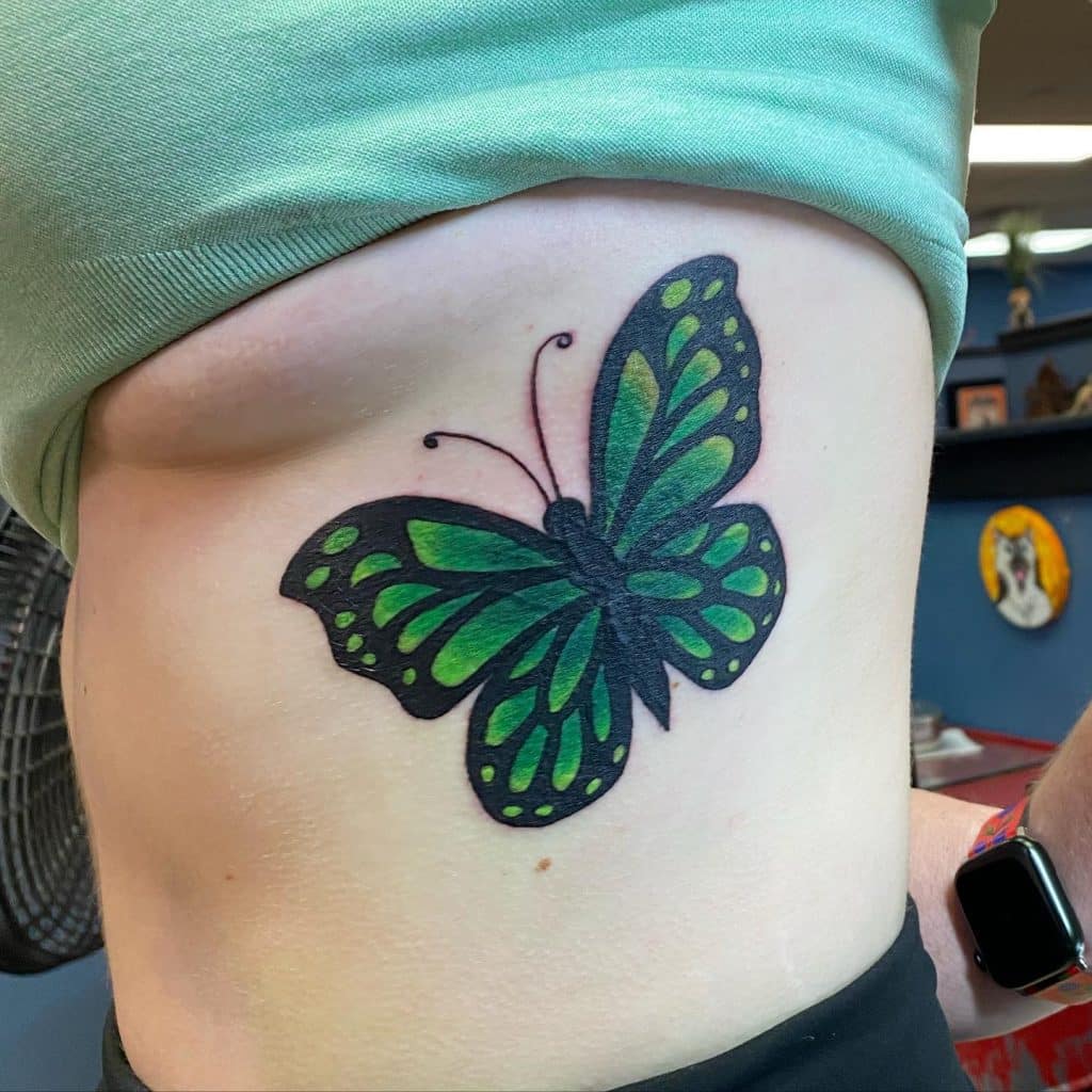 Big butterfly Tattoo on side belly for girls
