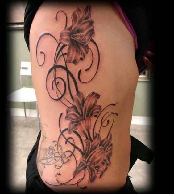 flowery branch for side belly tattoo for girls