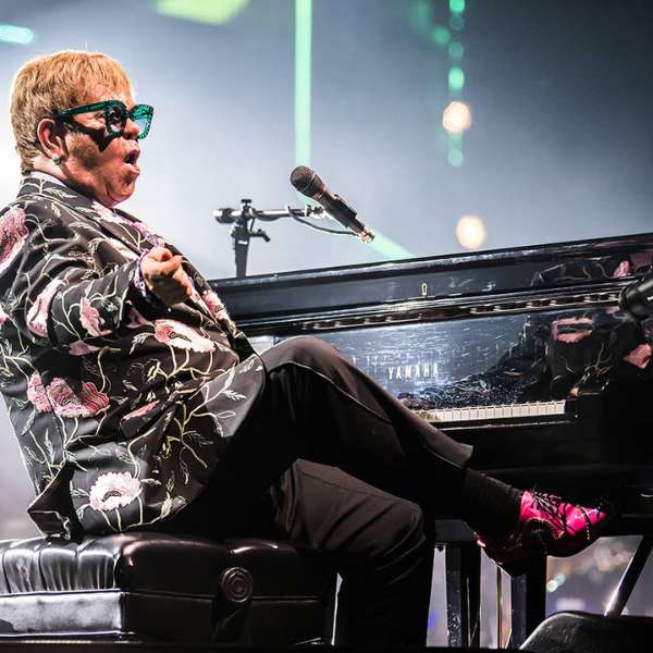Elton John Floral Jacket with Black Trouser and Pink Shoes