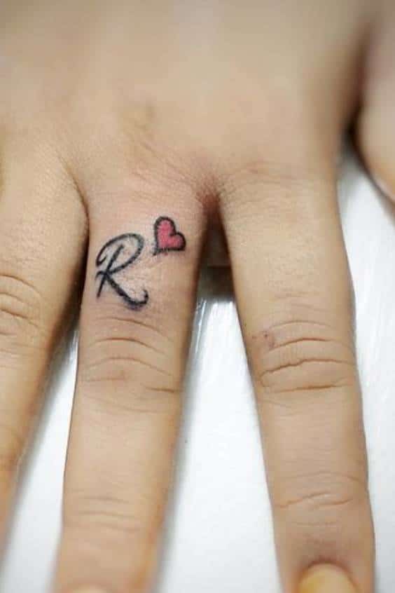 R letter tattoo with heart - R letter tattoo with heart on finger