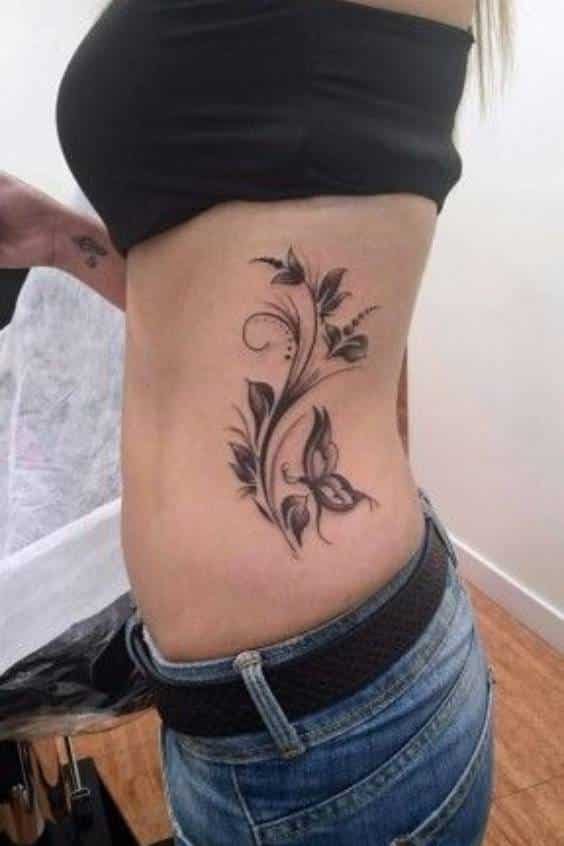Floral waist tattoo with vine