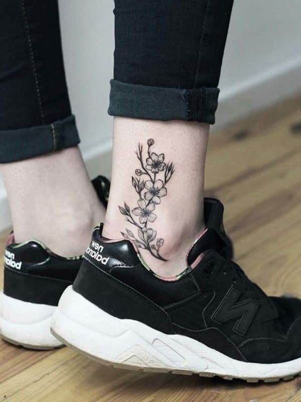 Meaningful floral Ankle Tattoo