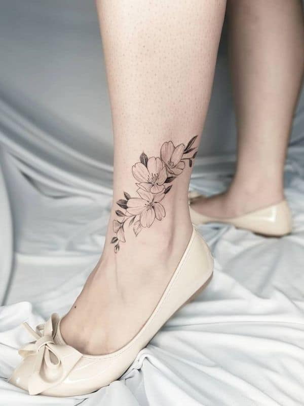 Lilly tattoo on Side Ankle