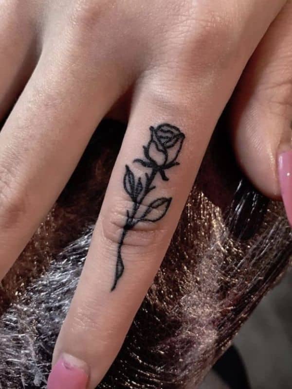 Beautiful Rose Tattoo on Middle Finger