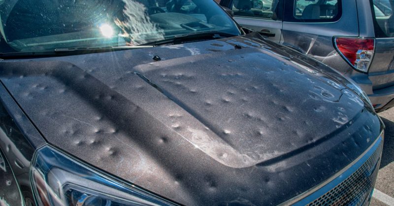 Hail damaging car