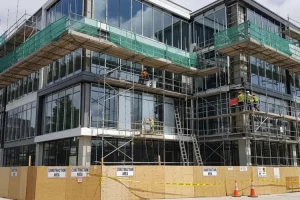 The New Face Of Commercial Makeovers: How Smart Owners Turn Renovations Into Long-Term Returns  Modern commercial building exterior under renovation.